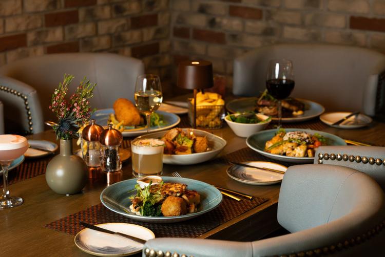 A table filled with a variety of delicious, freshly prepared food dishes at Dillisk on the Docks.