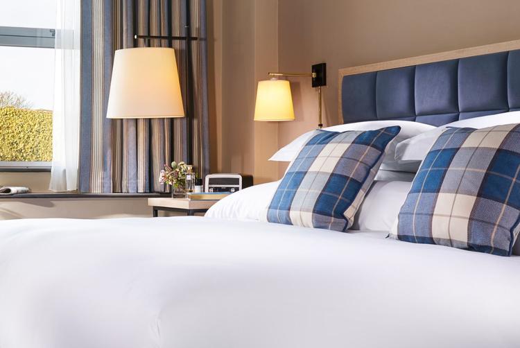 A modern and spacious Superior King Room with a large bed and contemporary decor at The Harbour Hotel Galway.